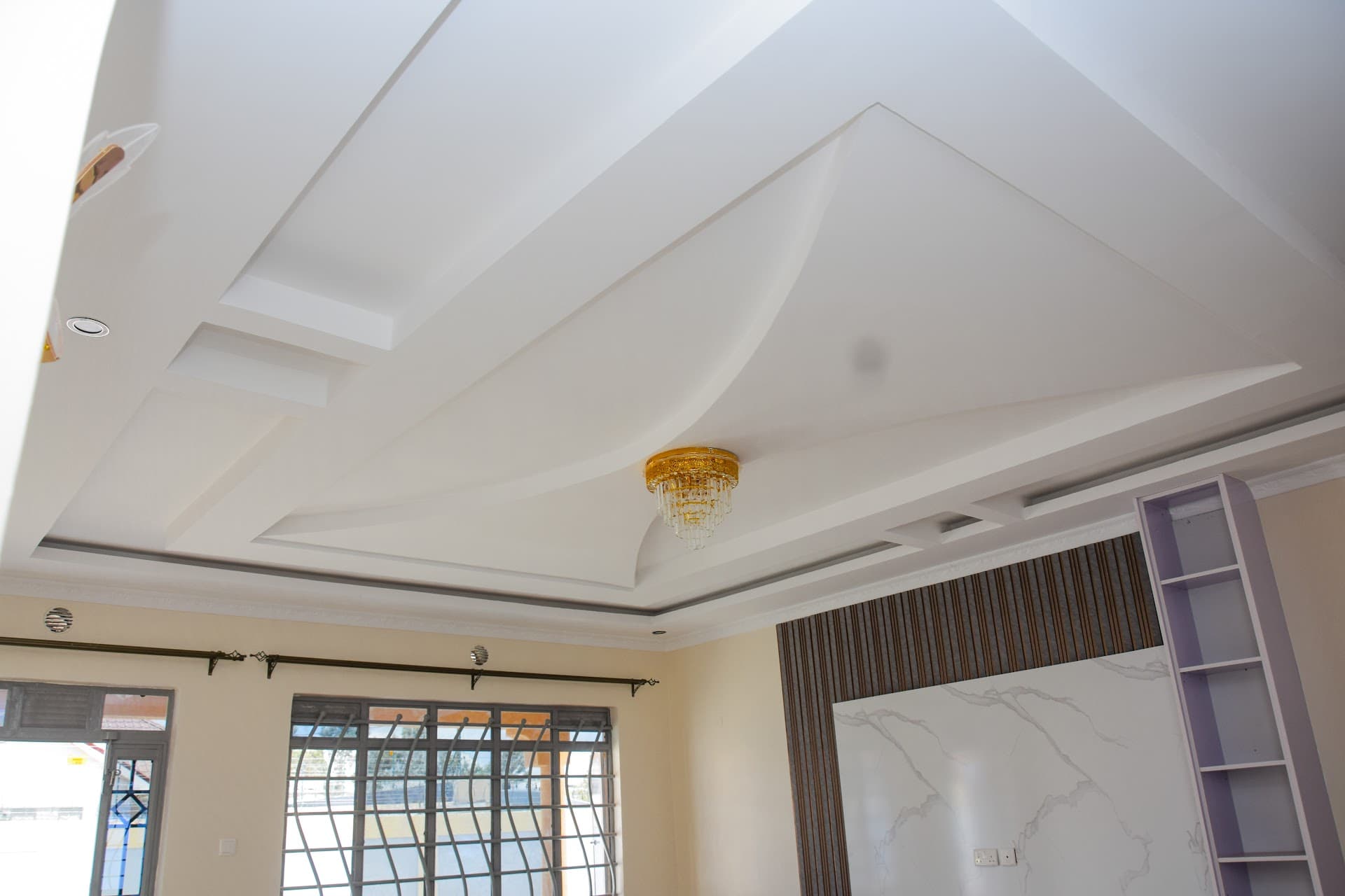 Modern Gypsum Ceiling Designs for Kenyan Living Rooms (With LED Cove Lighting)